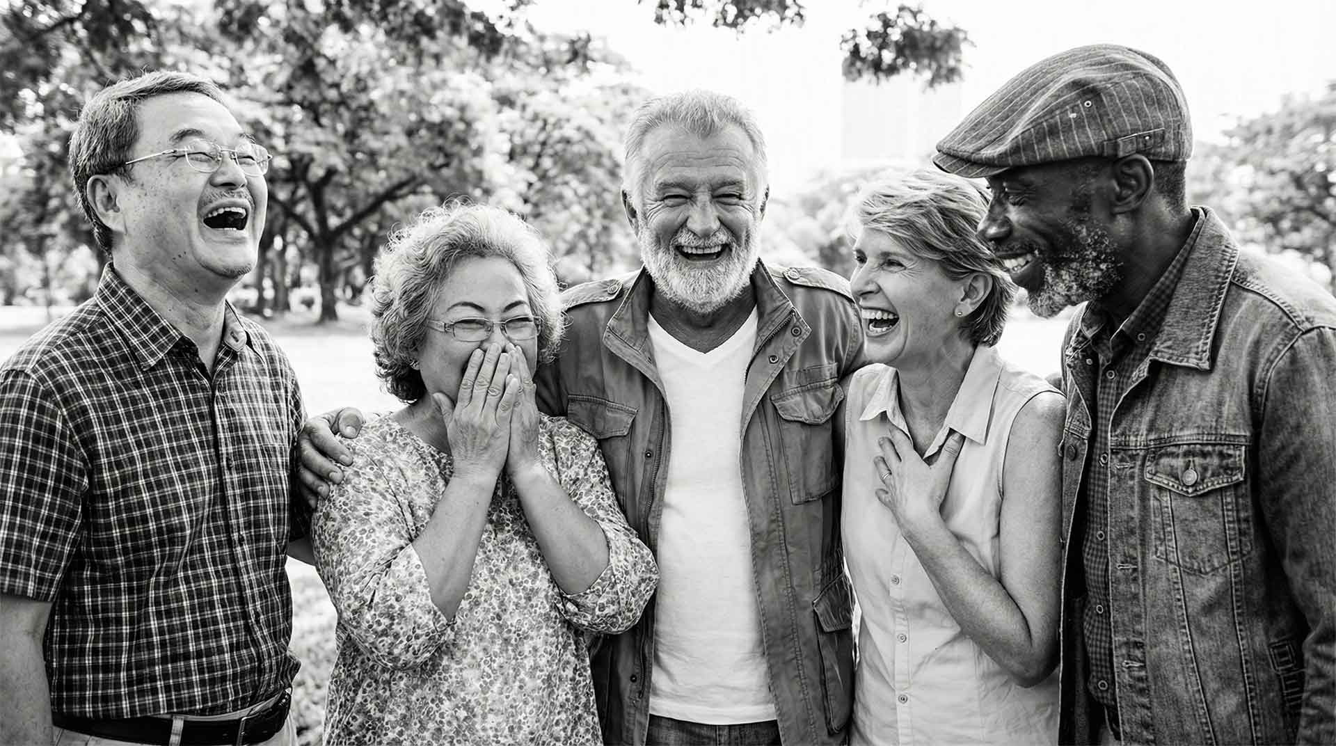 Group of senior friends laughing and smiling together