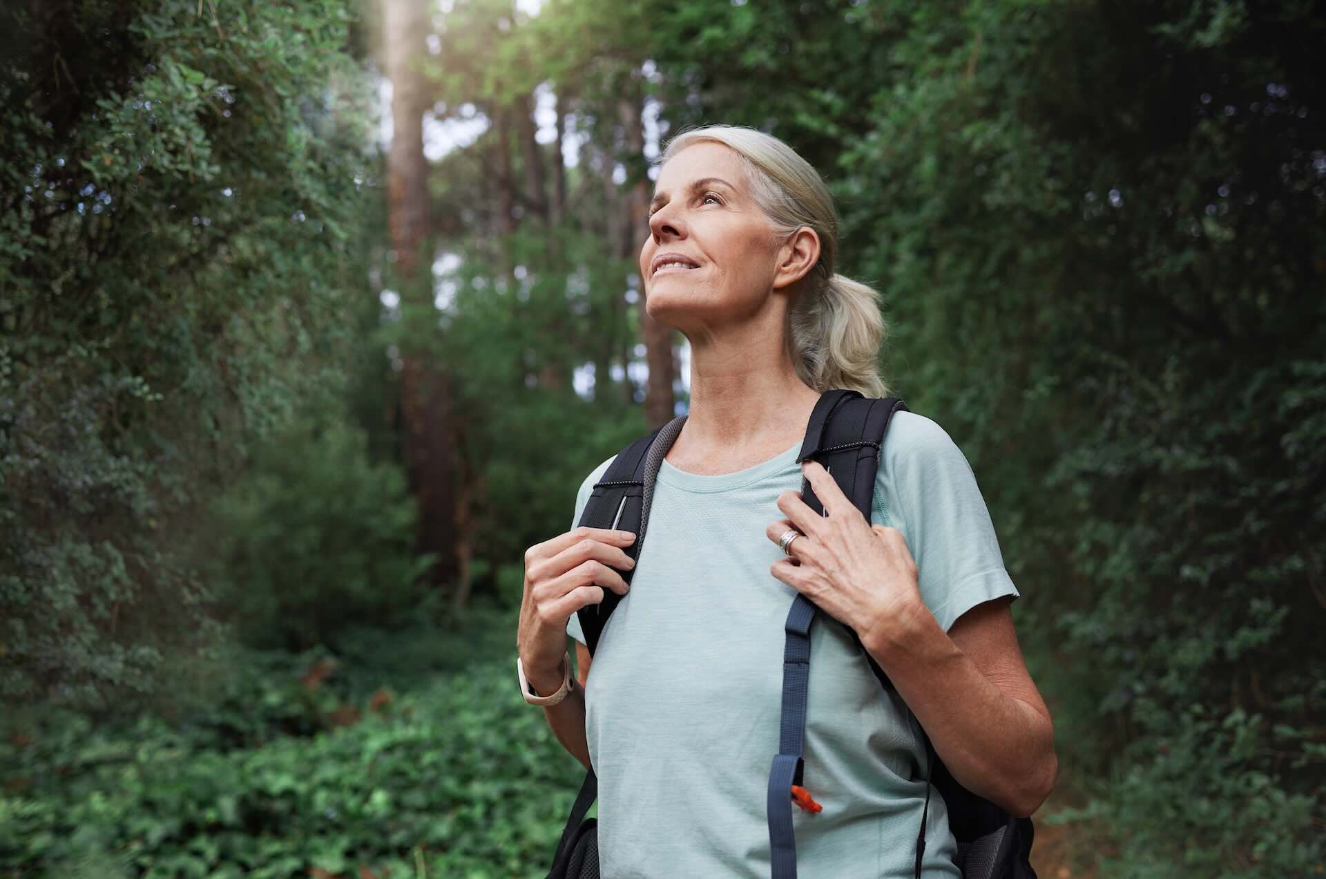 Woman hiking outdoors representing the financial journey